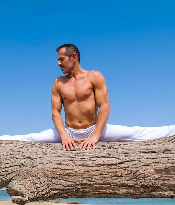 Man performing a controlled strength exercise in a calm environment.